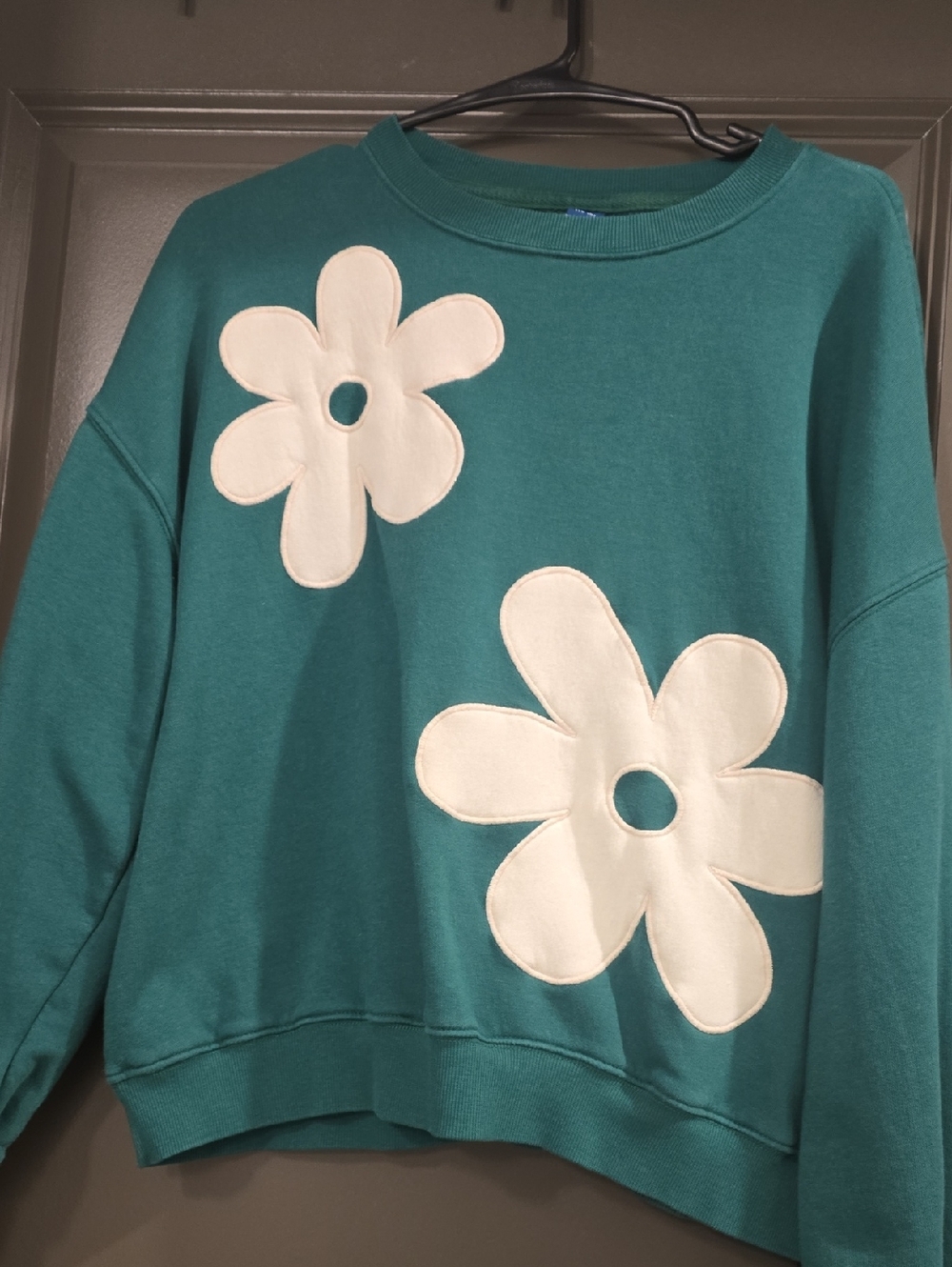 Old Navy green sweatshirt with cream flower detail